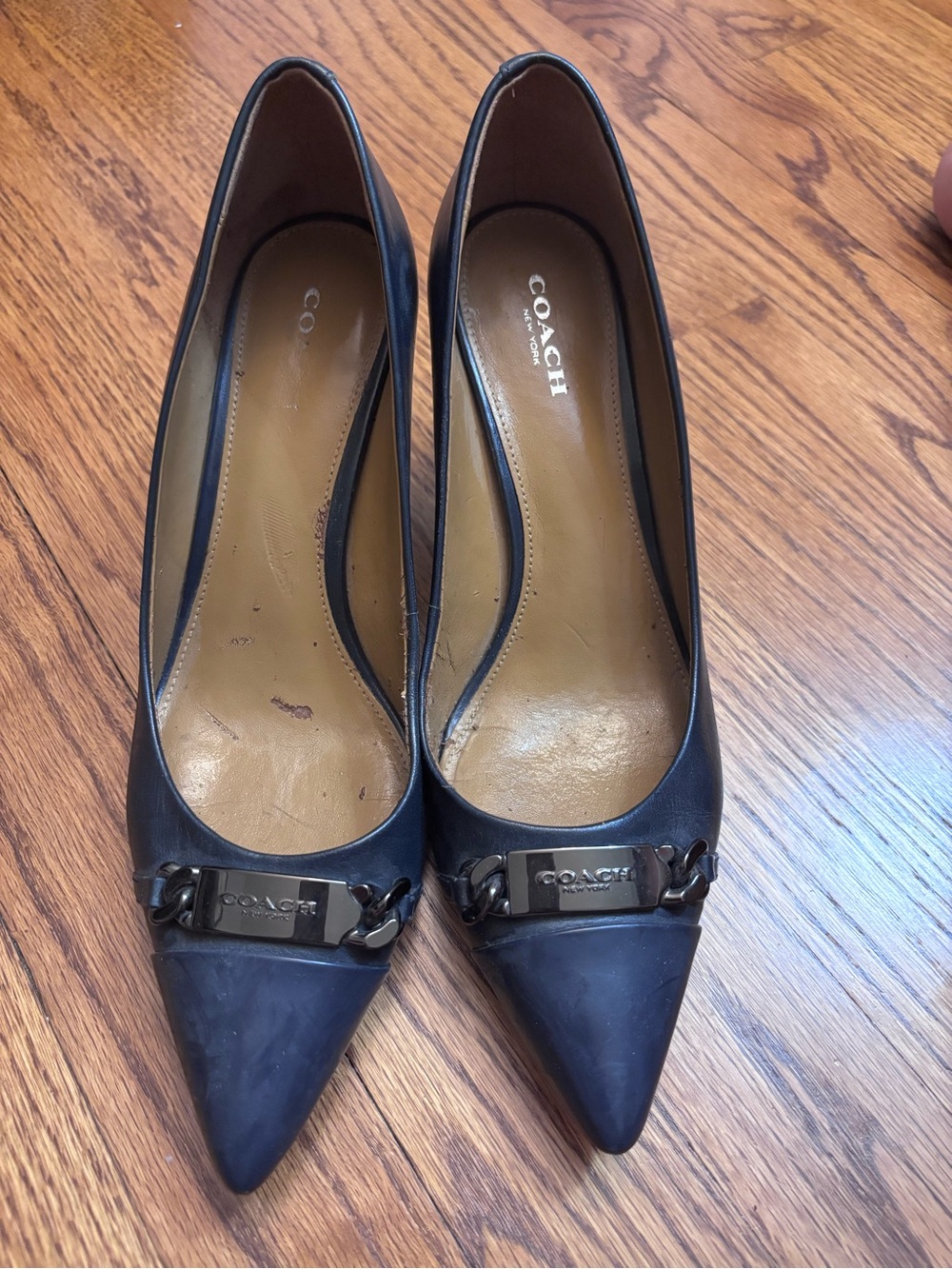 Coach Navy Pointed Toe Leather Pumps with Signature Metal Plaque